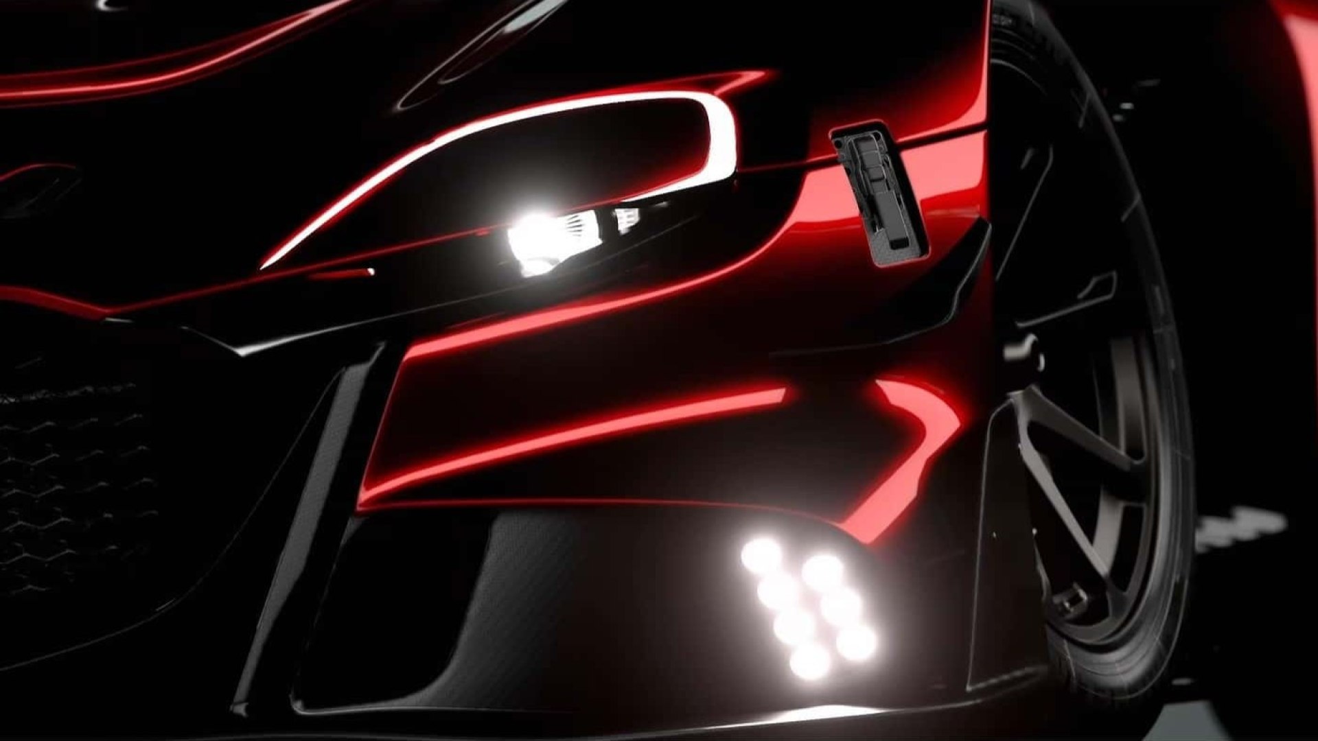 Un concept di auto sportiva con design aerodinamico e motore Wankel, mostrato in un simulatore di guida